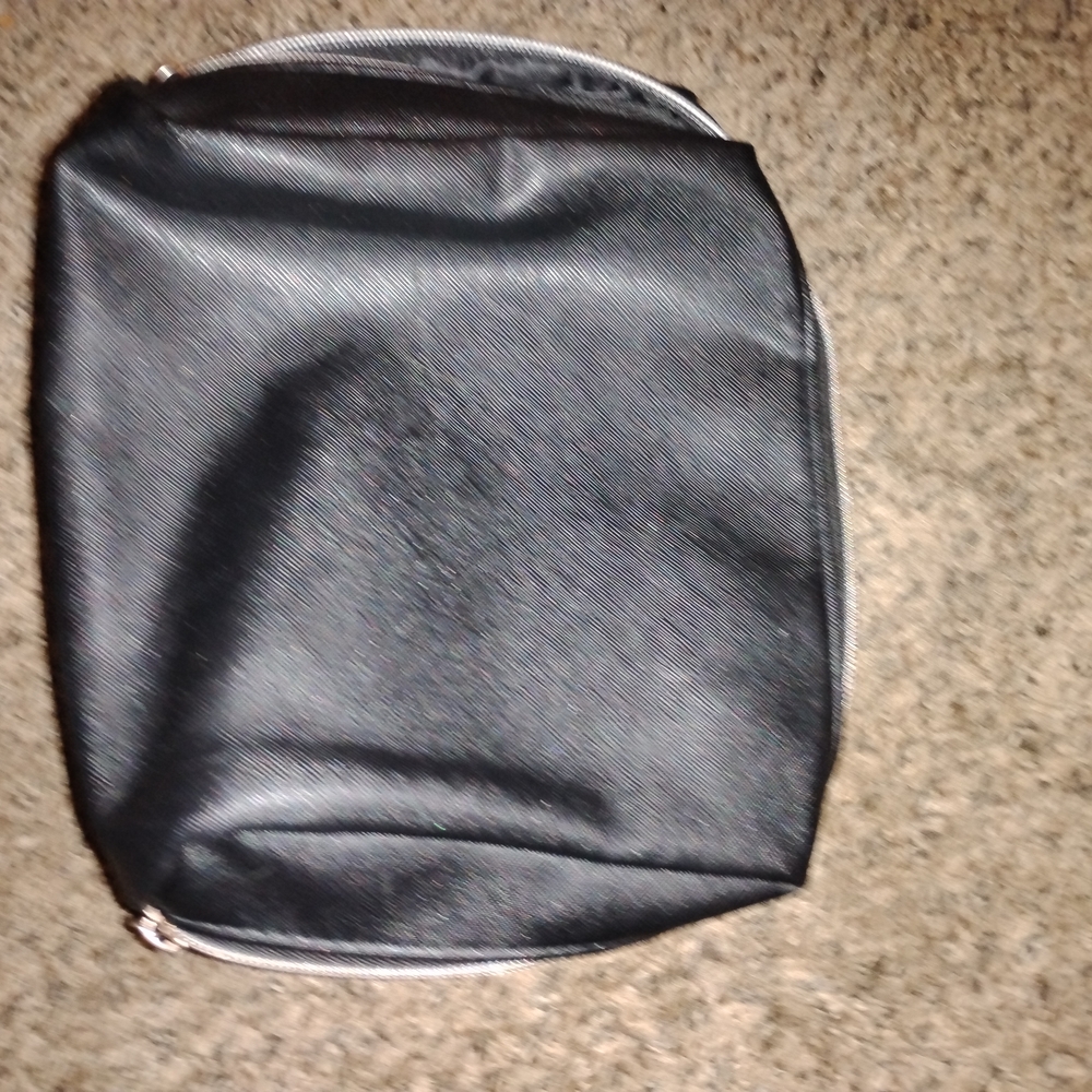 Compact Black Toiletry Bag with Zipper and Textured Finish
